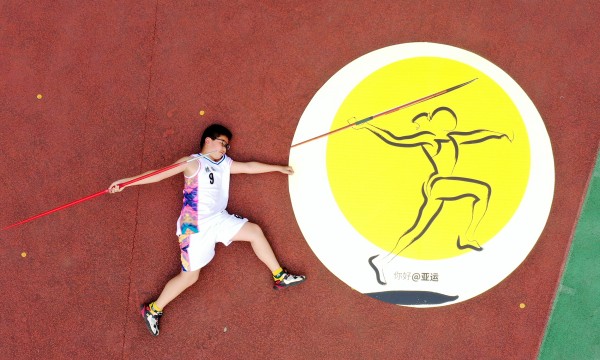 Ningbo students pose in celebration of upcoming Games